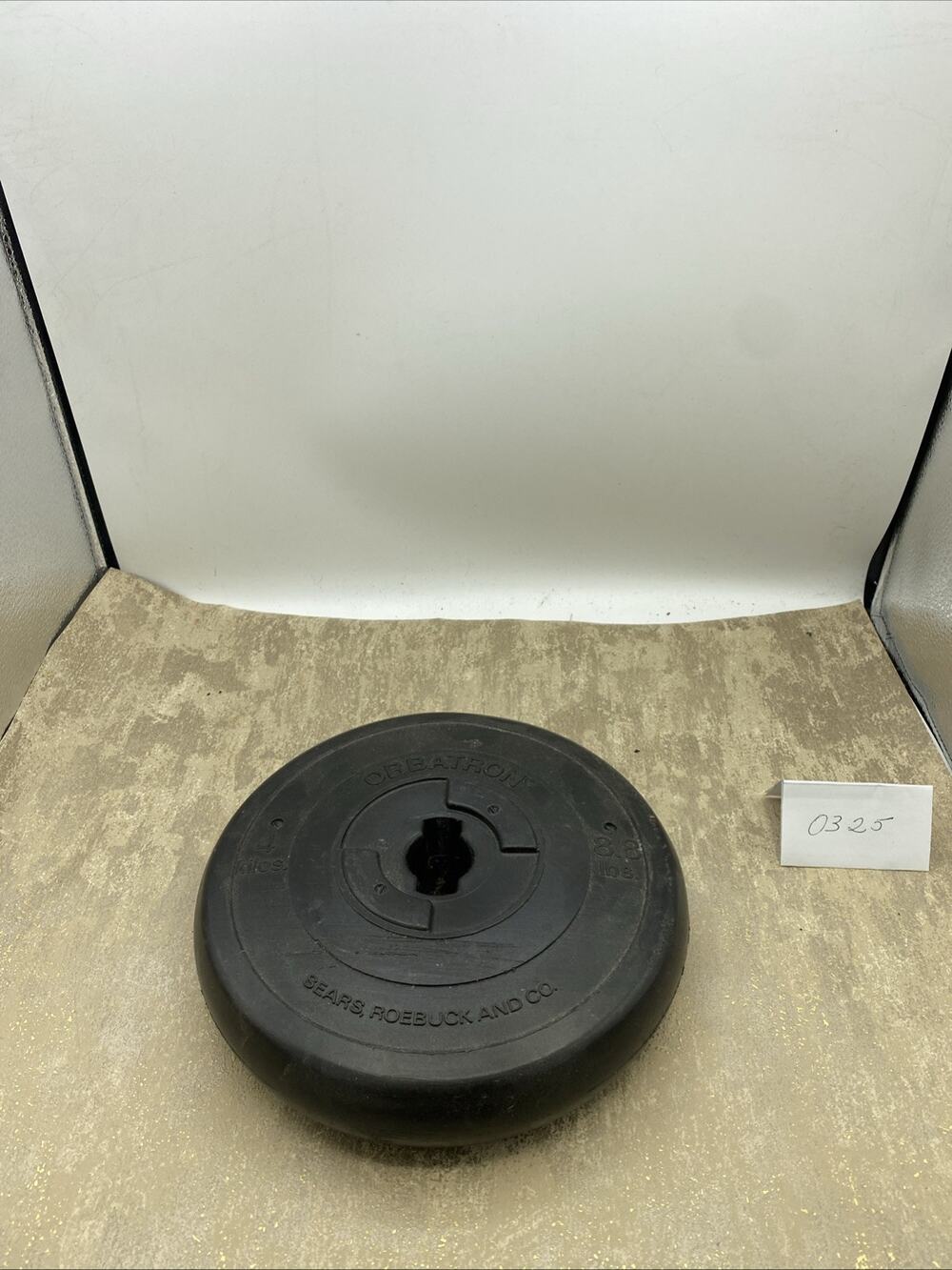 Sears Challenger Orbatron weights: 8.8 Lbs, 4 Kilos for 1" bar, plastic/concrete